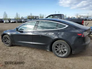 2019 Tesla Model 3 Mid Range z VIN 5YJ3E1EA7KF420025, wystawiony jako Copart lot #56149015 z przebiegiem 253 771 mil mil oraz Szkoda całkowita • Salvage title. Historia ofert i sprzedaży dostępna na DreamBid. Obrazek 2.