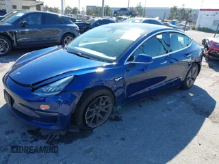 2019 Tesla Model 3 Mid Range with VIN 5YJ3E1EA8KF436086, listed as a IAAI auction lot 41682093 with 70,332 mi miles and . Bid and sale history available at DreamBid. Image 2.