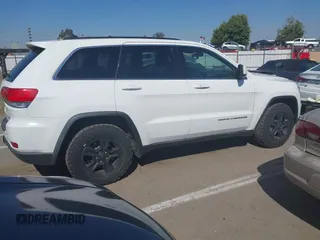 2014 Jeep Grand Cherokee Laredo with VIN 1C4RJFAG9EC334021, listed as a IAAI auction lot 42128823 with 161,741 mi miles. Bid and sale history available at carsss.com. Image 13.