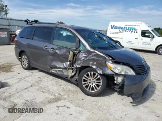 2015 Toyota Sienna XLE with VIN 5TDYK3DC5FS643985, listed as a Copart auction lot 56956505 with 179,131 mi miles and Salvage title. Bid and sale history available at DreamBid. Image 4.