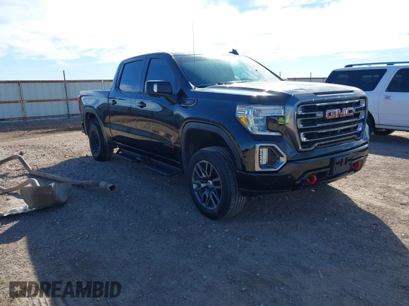 2021 GMC Sierra 1500 AT4 with VIN 1GTU9EETXMZ230606, listed as a IAAI auction lot 41599778 with 128,745 mi miles. Bid and sale history available at carsss.com. Image 1.