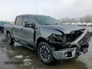 2018 Nissan Titan Pro-4X z VIN 1N6AA1E51JN536680, wystawiony jako Copart lot #82361724 z przebiegiem 98 699 mil mil oraz Szkoda całkowita • Salvage title. Historia ofert i sprzedaży dostępna na DreamBid. Obrazek 13.
