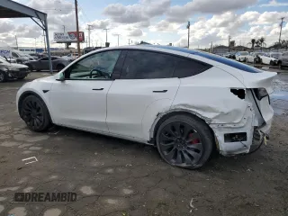 2021 Tesla Model Y Performance with VIN 5YJYGDEF4MF201815, listed as a Copart auction lot 42453075 with 76,888 mi miles and Salvage Title. Bid and sale history available at DreamBid. Image 2.