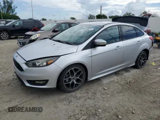 2015 Ford Focus SE with VIN 1FADP3F24FL311659, listed as a Copart auction lot 64600075 with 128,461 mi miles and Salvage title. Bid and sale history available at DreamBid. Image 1.