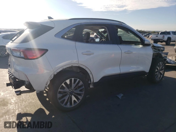 2022 Ford Escape Titanium z VIN 1FMCU9J91NUB93886, wystawiony jako Copart lot #69189524 z przebiegiem Nie podano mil oraz Czysty tytuł • Clean title. Historia ofert i sprzedaży dostępna na DreamBid. Obrazek 3.