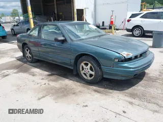 1997 Oldsmobile Cutlass Supreme S z VIN 1G3WH12M9VF317272, wystawiony jako IAAI lot #42346360 z przebiegiem 156 553 mil mil oraz . Historia ofert i sprzedaży dostępna na DreamBid. Obrazek 1.