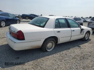 2002 Mercury Grand Marquis LS Premium z VIN 2MEFM75W52X666147, wystawiony jako Copart lot #58970815 z przebiegiem 133 495 mil mil oraz Szkoda całkowita • Salvage title. Historia ofert i sprzedaży dostępna na DreamBid. Obrazek 3.