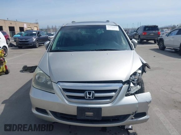 2006 Honda Odyssey EX-L z VIN 5FNRL38736B089963, wystawiony jako IAAI lot #41858061 z przebiegiem 178 845 mil mil oraz . Historia ofert i sprzedaży dostępna na DreamBid. Obrazek 12.