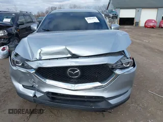 2020 Mazda CX-5 Touring with VIN JM3KFACM5L0768371, listed as a IAAI auction lot 41862623 with 138,446 mi miles and . Bid and sale history available at carsss.com. Image 12.