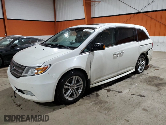 2012 Honda Odyssey Touring with VIN 5FNRL5H94CB508363, listed as a Copart auction lot 42777305 with 158,040 mi miles and Salvage Title. Bid and sale history available at DreamBid. Image 1.