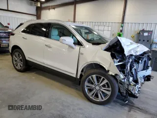 2025 Cadillac XT5 FWD Premium Luxury with VIN 1GYKNCRSXSZ106707, listed as a Copart auction lot 86919854 with 1,879 mi miles and Salvage Title. Bid and sale history available at DreamBid. Image 4.