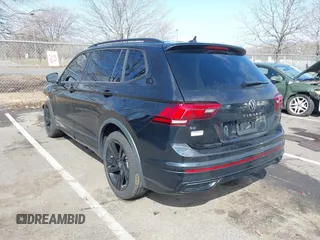 2023 Volkswagen Tiguan SE R-Line Black with VIN 3VVCB7AXXPM094621, listed as a IAAI auction lot 41737103 with 21,069 mi miles and . Bid and sale history available at DreamBid. Image 3.