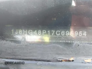 2007 Jeep Commander Sport z VIN 1J8HG48P17C695954, wystawiony jako IAAI lot #42106559 z przebiegiem Nie podano mil oraz . Historia ofert i sprzedaży dostępna na DreamBid. Obrazek 9.