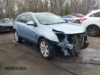 2013 Cadillac SRX Premium Collection z VIN 3GYFNEE33DS605330, wystawiony jako IAAI lot #41916593 z przebiegiem 122 362 mil mil oraz . Historia ofert i sprzedaży dostępna na DreamBid. Obrazek 1.