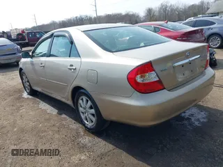2004 Toyota Camry LE with VIN 4T1BF30K94U587836, listed as a IAAI auction lot 41714277 with 211,893 mi miles and . Bid and sale history available at carsss.com. Image 3.