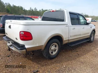 2001 Ford F-150 XLT with VIN 1FTRW07641KC51870, listed as a IAAI auction lot 41879102 with 202,967 mi miles and . Bid and sale history available at DreamBid. Image 4.