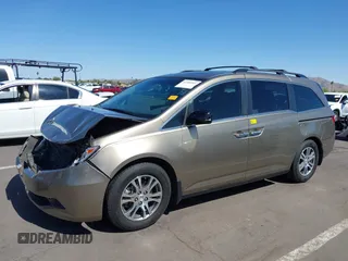 2012 Honda Odyssey EX-L z VIN 5FNRL5H63CB033049, wystawiony jako IAAI lot #42260501 z przebiegiem 165 693 mil mil oraz . Historia ofert i sprzedaży dostępna na DreamBid. Obrazek 2.