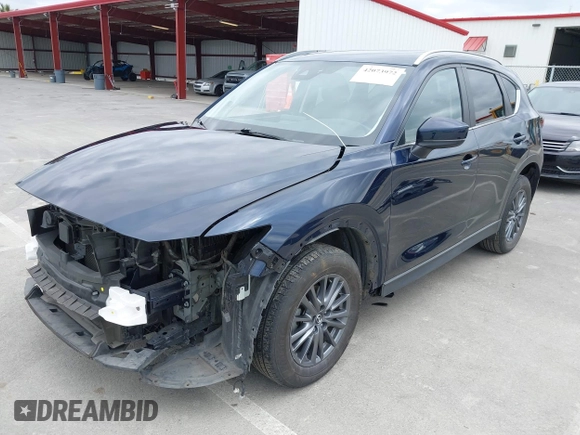 2020 Mazda CX-5 Touring with VIN JM3KFACM2L0856777, listed as a IAAI auction lot 42073972 with 151,628 mi miles. Bid and sale history available at carsss.com. Image 2.