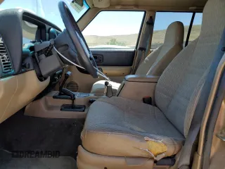 1999 Jeep Cherokee Sport z VIN 1J4FF68S7XL553295, wystawiony jako Copart lot #62390915 z przebiegiem 358 587 mil mil oraz Czysty tytuł • Clean title. Historia ofert i sprzedaży dostępna na DreamBid. Obrazek 7.