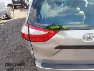 2015 Toyota Sienna L with VIN 5TDZK3DCXFS596277, listed as a IAAI auction lot 41229427 with 108,900 mi miles and . Bid and sale history available at DreamBid. Image 18.