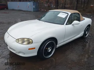 2002 Mazda MX-5 Miata Cloth z VIN JM1NB353420221527, wystawiony jako IAAI lot #41909623 z przebiegiem 90 260 mil mil oraz . Historia ofert i sprzedaży dostępna na DreamBid. Obrazek 6.