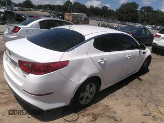 2015 Kia Optima LX with VIN KNAGM4A70F5645049, listed as a IAAI auction lot 42758383 with 214,934 mi miles and . Bid and sale history available at DreamBid. Image 4.
