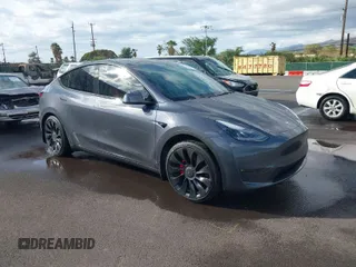 2022 Tesla Model Y Performance z VIN 7SAYGDEFXNF452231, wystawiony jako IAAI lot #41429980 z przebiegiem 23 574 mil mil oraz . Historia ofert i sprzedaży dostępna na DreamBid. Obrazek 1.