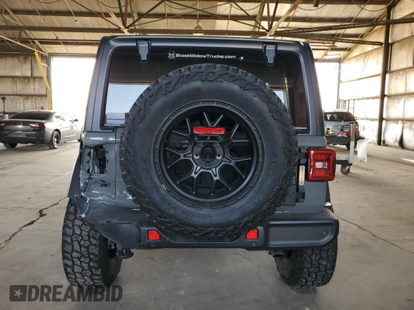 2022 Jeep Wrangler Unlimited High Tide with VIN 1C4HJXDG2NW221829, listed as a Copart auction lot 64836074 with 3,394 mi miles and Salvage Title. Bid and sale history available at DreamBid. Image 6.