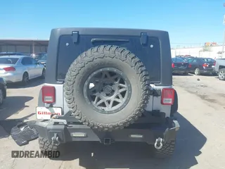 2012 Jeep Wrangler Unlimited Sport with VIN 1C4BJWDG8CL270788, listed as a IAAI auction lot 41758929 with 138,935 mi miles. Bid and sale history available at carsss.com. Image 16.