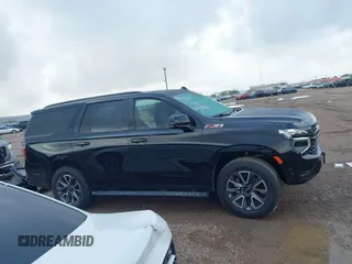 2023 Chevrolet Tahoe Z71 with VIN 1GNSKPKD9PR389603, listed as a IAAI auction lot 42082916 with 33,843 mi miles and . Bid and sale history available at DreamBid. Image 14.