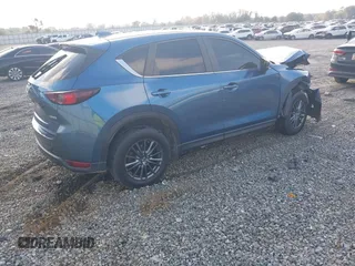 2020 Mazda CX-5 Touring with VIN JM3KFACM0L0775020, listed as a IAAI auction lot 40876970 with 96,424 mi miles. Bid and sale history available at carsss.com. Image 4.