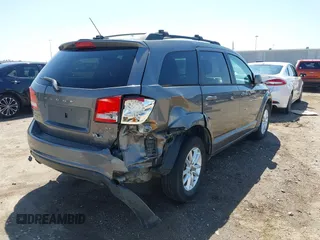 2013 Dodge Journey SXT with VIN 3C4PDDBGXDT650886, listed as a IAAI auction lot 41864331 with 224,579 mi miles and . Bid and sale history available at DreamBid. Image 4.
