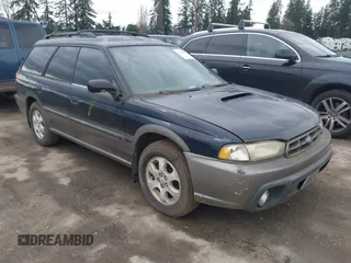 1999 Subaru Legacy Outback z VIN 4S3BG6850X7660015, wystawiony jako IAAI lot #41783811 z przebiegiem 156 093 mil mil oraz . Historia ofert i sprzedaży dostępna na DreamBid. Obrazek 1.