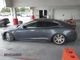 2021 Tesla Model S Long Range Plus with VIN 5YJSA1E28MF421655, listed as a IAAI auction lot 42407234 with 111,443 mi miles and . Bid and sale history available at DreamBid. Image 14.