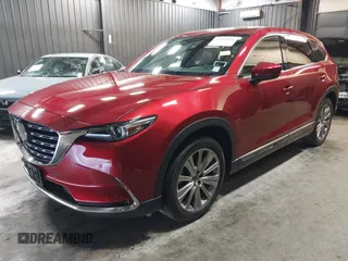2023 Mazda CX-9 Signature z VIN JM3TCBEY4P0634153, wystawiony jako IAAI lot #42132856 z przebiegiem 25 131 mil mil oraz . Historia ofert i sprzedaży dostępna na DreamBid. Obrazek 2.