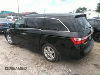 2012 Honda Odyssey Touring with VIN 5FNRL5H97CB066596, listed as a IAAI auction lot 42472935 with 217,182 mi miles and . Bid and sale history available at DreamBid. Image 3.