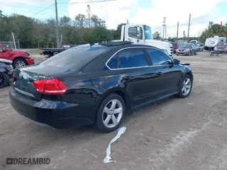 2014 Volkswagen Passat SE w/Sunroof with VIN 1VWBT7A30EC055472, listed as a IAAI auction lot 40975011 with 133,967 mi miles. Bid and sale history available at carsss.com. Image 4.