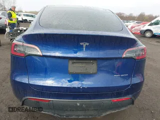 2023 Tesla Model Y Long Range z VIN 7SAYGDEE2PF694974, wystawiony jako IAAI lot #41814582 z przebiegiem 31 726 mil mil oraz . Historia ofert i sprzedaży dostępna na DreamBid. Obrazek 16.