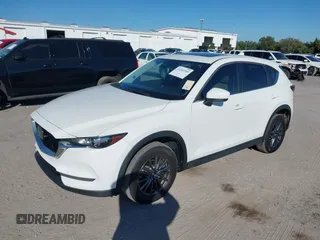 2020 Mazda CX-5 Touring with VIN JM3KFACM6L0737727, listed as a IAAI auction lot 41283200 with 85,949 mi miles and . Bid and sale history available at carsss.com. Image 19.