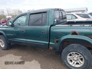 2001 Dodge Dakota Sport z VIN 1B7HG2ANX1S256902, wystawiony jako IAAI lot #42037703 z przebiegiem 121 914 mil mil oraz . Historia ofert i sprzedaży dostępna na DreamBid. Obrazek 14.