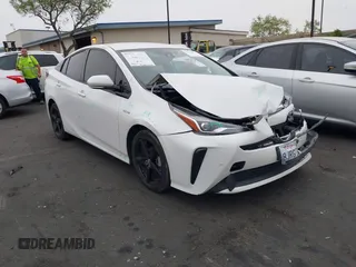 2019 Toyota Prius L Eco z VIN JTDKARFU3K3076849, wystawiony jako IAAI lot #42173977 z przebiegiem 92 304 mil mil oraz . Historia ofert i sprzedaży dostępna na DreamBid. Obrazek 1.