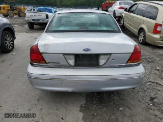 2000 Ford Crown Victoria with VIN 2FAFP73W6YX117101, listed as a Copart auction lot 66004304 with 124,011 mi miles and Clean Title. Bid and sale history available at carsss.com. Image 6.