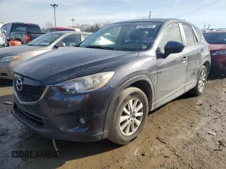 2014 Mazda CX-5 Touring with VIN JM3KE2CYXE0341864, listed as a Copart auction lot 43790015 with 146,827 mi miles and Clean Title. Bid and sale history available at DreamBid. Image 1.