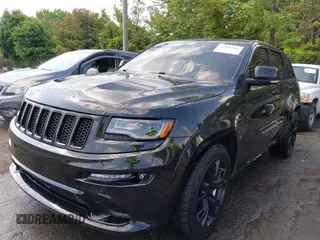 2014 Jeep Grand Cherokee SRT-8 z VIN 1C4RJFDJ2EC174412, wystawiony jako IAAI lot #42116541 z przebiegiem 124 693 mil mil oraz . Historia ofert i sprzedaży dostępna na DreamBid. Obrazek 2.