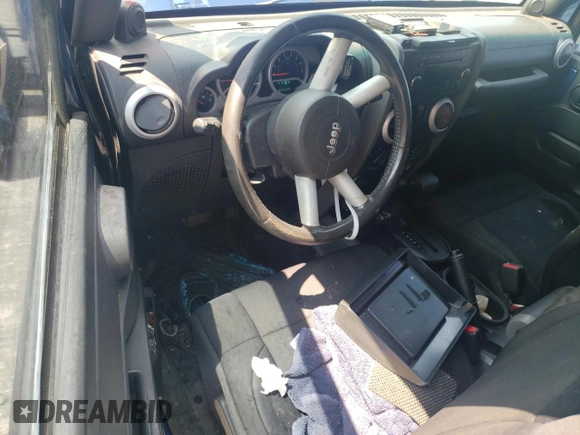 2009 Jeep Wrangler Sahara with VIN 1J4FA54199L747528, listed as a Copart auction lot 80974584 with 226,299 mi miles and Salvage title. Bid and sale history available at DreamBid. Image 8.