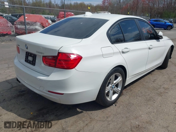 2015 BMW 3 Series 328i xDrive with VIN WBA3B5C51FF960765, listed as a IAAI auction lot 42074658 with 106,598 mi miles and . Bid and sale history available at DreamBid. Image 4.