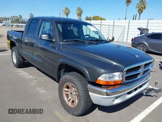 2002 Dodge Dakota SLT with VIN 1B7HG48N82S634864, listed as a IAAI auction lot 41839572 with 138,557 mi miles. Bid and sale history available at carsss.com. Image 1.