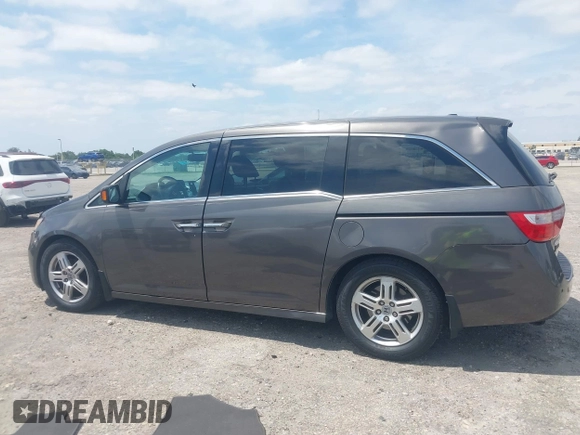 2012 Honda Odyssey Touring with VIN 5FNRL5H90CB088536, listed as a IAAI auction lot 42102008 with 283,350 mi miles and . Bid and sale history available at DreamBid. Image 14.