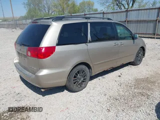 2009 Toyota Sienna XLE with VIN 5TDZK22CX9S257522, listed as a IAAI auction lot 42113875 with 214,873 mi miles. Bid and sale history available at carsss.com. Image 4.