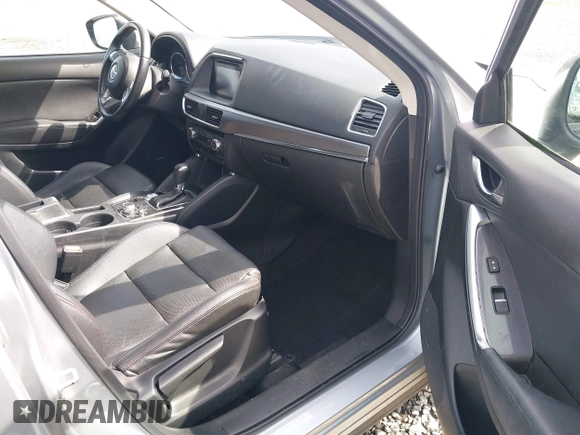 2016 Mazda CX-5 Grand Touring with VIN JM3KE4DYXG0647802, listed as a IAAI auction lot 41996854 with 85,774 mi miles. Bid and sale history available at carsss.com. Image 5.